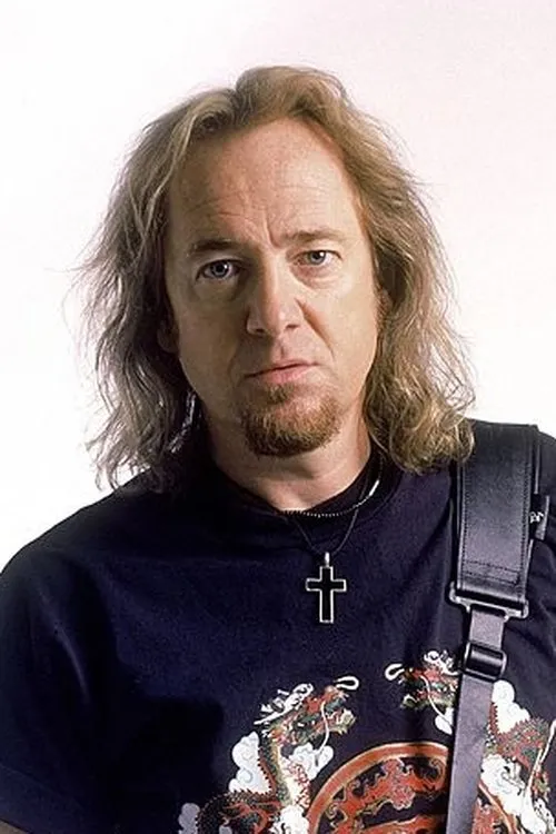 Adrian Smith interpretando a Guitar/Backing Vocals