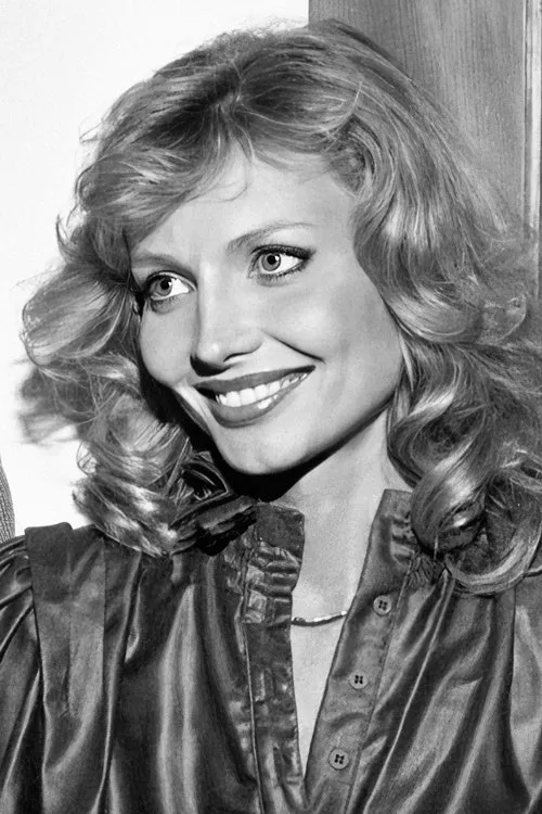 Cindy Morgan interpretando a Detective Kelly