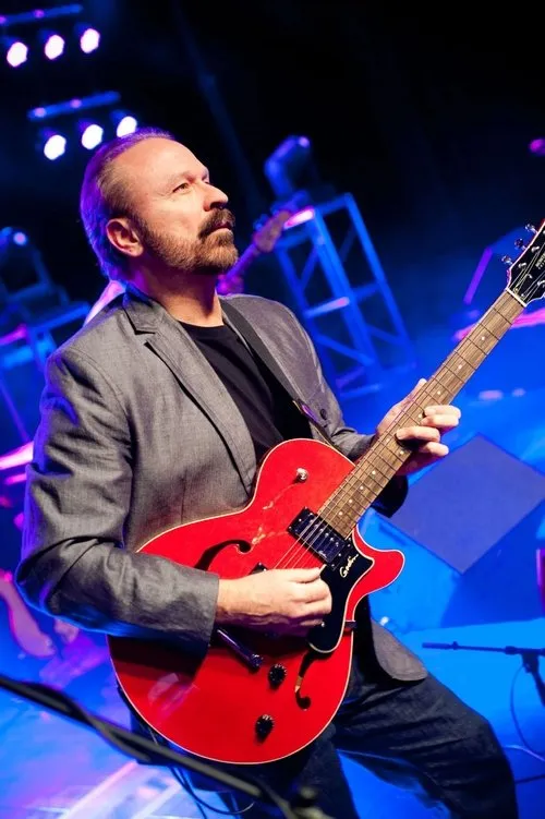 Daryl Stuermer interpretando a Self (archive footage)