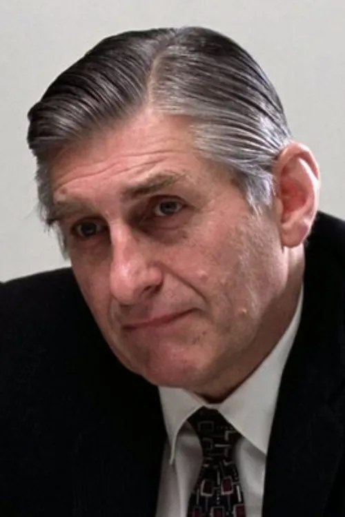 Dean R. Brooks interpretando a Dr. John Spivey