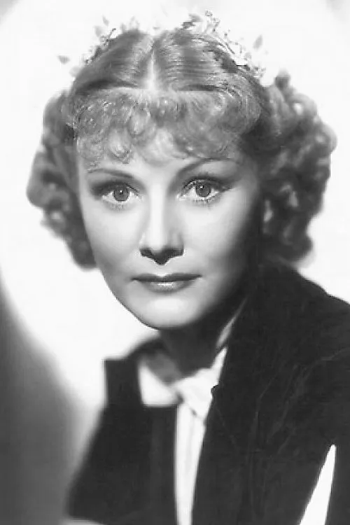 Drue Leyton interpretando a Mrs. Louise Mockby