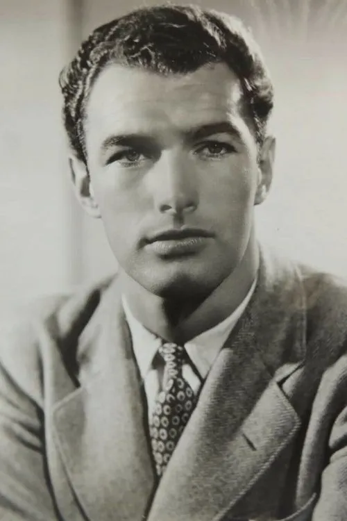 Garrett Craig interpretando a John Adair (uncredited)