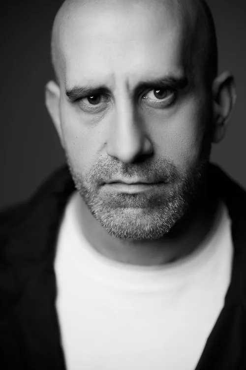 John Vizaniaris — personaje: Self - Host