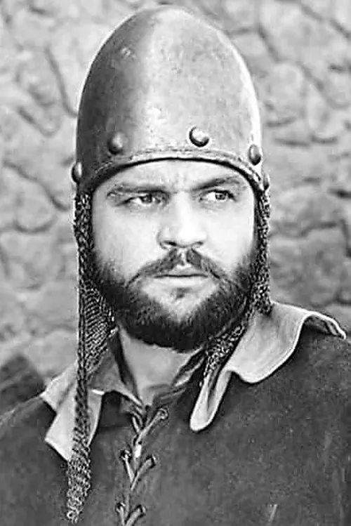 Malcolm Waite interpretando a Ted Grant