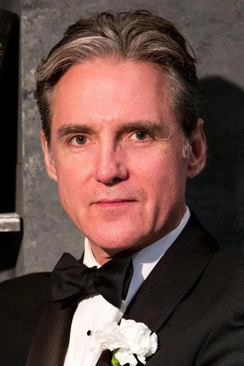 Michael Praed interpretando a Jake Lovell