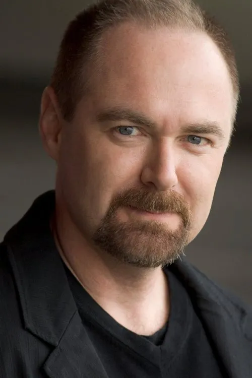 William MacDonald interpretando a Dr. Karros