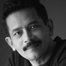 Atul Kulkarni como Ramesh Dholakia