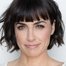 Constance Zimmer como Janine Skorsky