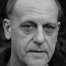 David Troughton como Chief Inspector Benson