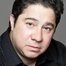 Greg Romero Wilson como Louie Cruz