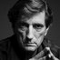 Harry Dean Stanton como Roman Grant