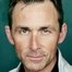 James Patrick Stuart como Vic Madden / Kraniac