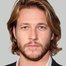 Luke Bracey como Jamie Caplan