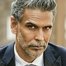 Milind Soman como Dr. Aamir Warsi