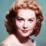 Rhonda Fleming como Carmelita Flanagan