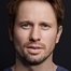 Tyler Ritter como US Attorney John Brownlee
