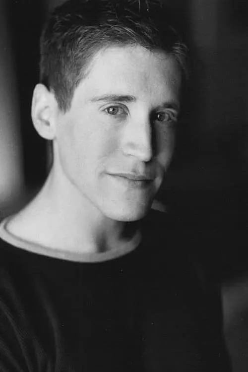 Graham Norris interpretando a Einstein