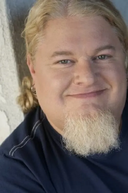 Greg Baker — personaje: Burger Pitt