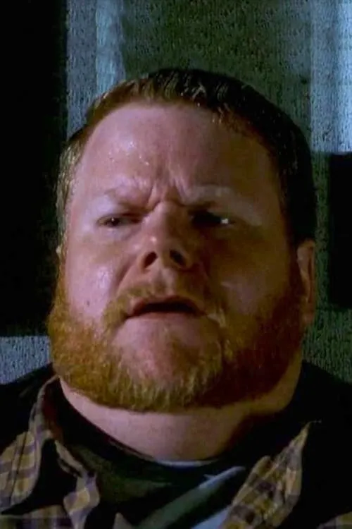 Malcolm Scott interpretando a Warren