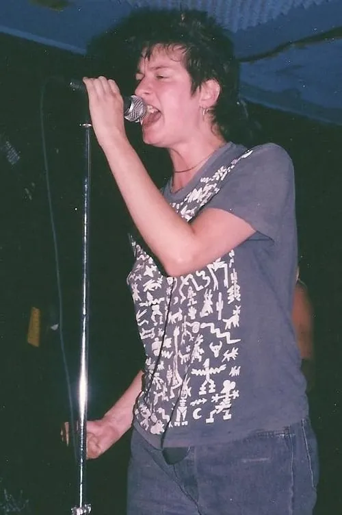 Mia Zapata interpretando a Self (archive footage)