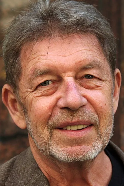 Pete Hamill interpretando a Frank Burroughs