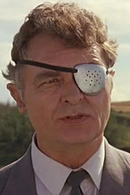 Robert Koons interpretando a Sheriff Ticker