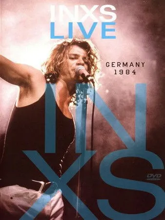 Andrew Farriss interpreta a Keyboards / Guitar en INXS: Live Germany 1984