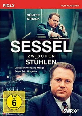 Rolf Becker interpreta a Assistent Schleussner en Sessel zwischen den Stühlen